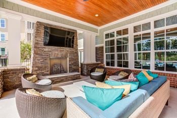 Multiple outdoor fireplaces with cozy seating areas